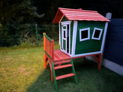 Children’s outdoor playhouse with slide